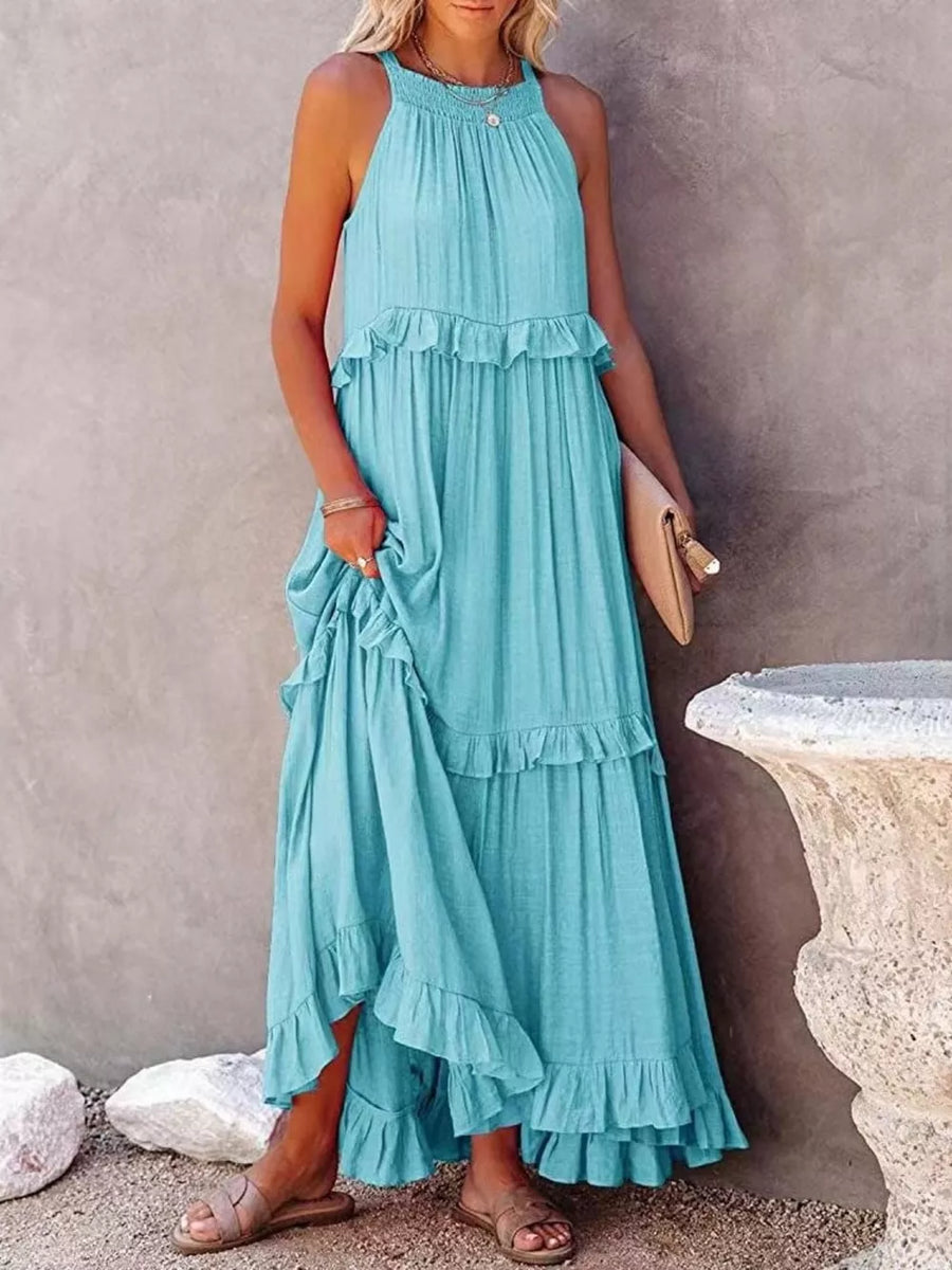 Light blue ruffled maxi dress with smocked bodice and tiered skirt.