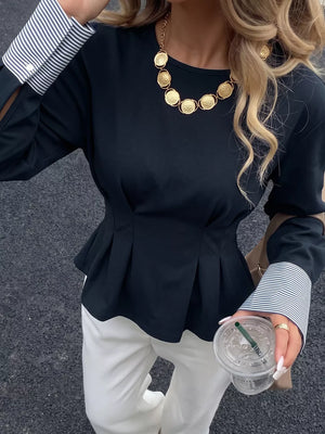 95% polyester, 5% elastane Care instructions: Machine wash cold peplum top in navy blue with fitted silhouette