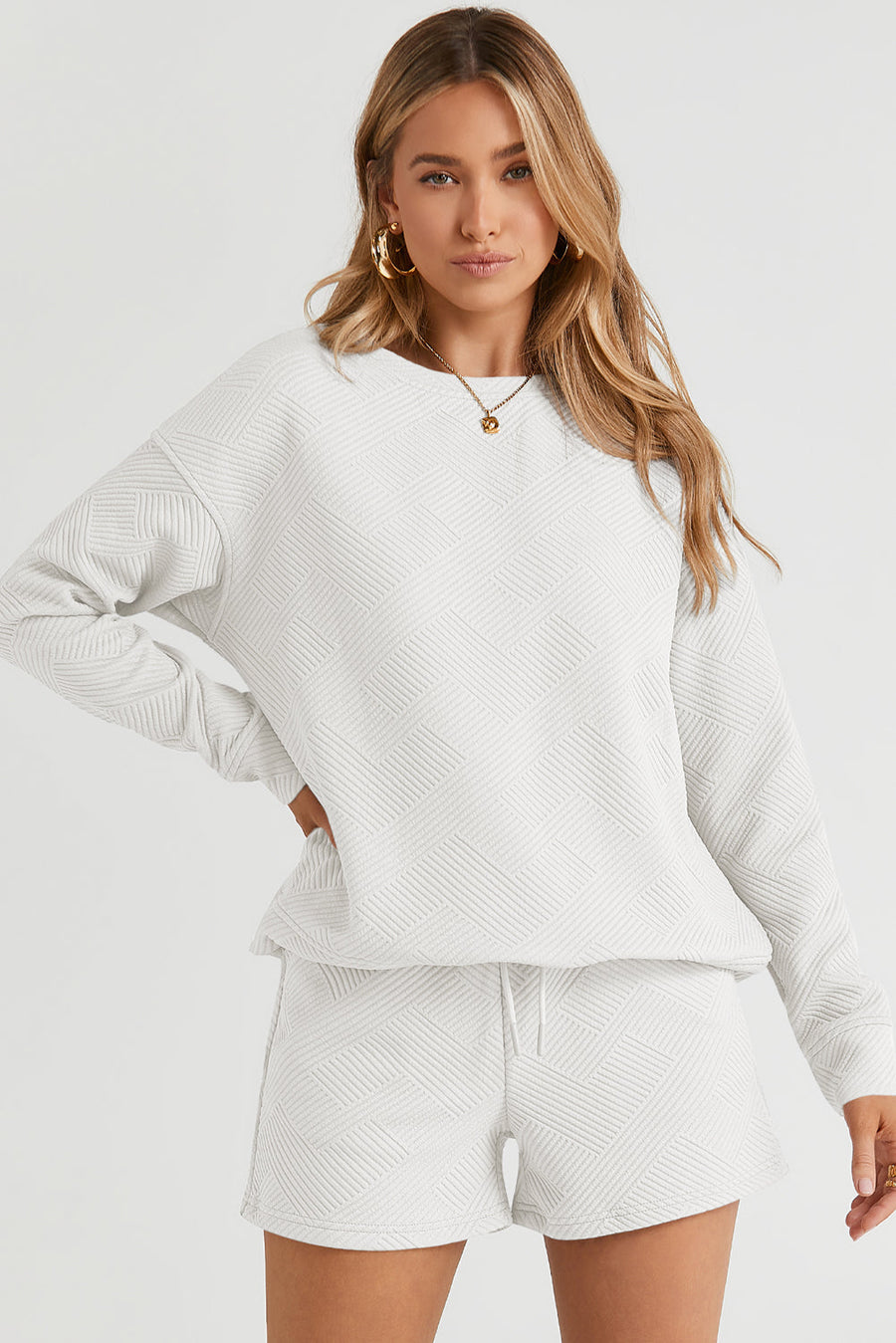 White textured crewneck sweater with long sleeves