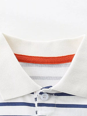 White and blue striped cotton polo shirt with orange trim and button placket.