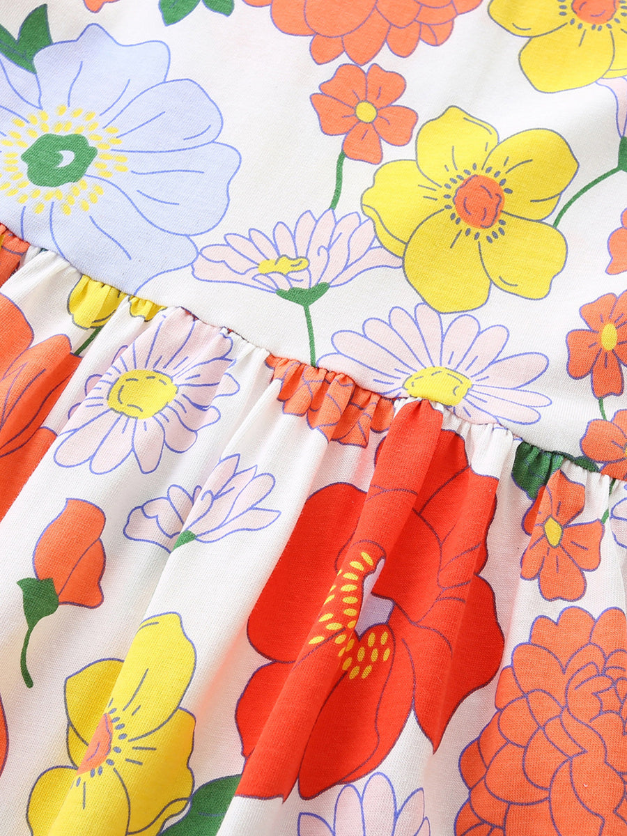 Toddler dress with playful floral print, ruffle detail, and cotton fabric.