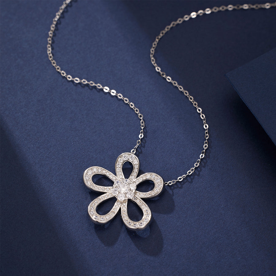 clear necklace featuring flower pendant and floral