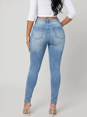 skinny jeans in Peacock Blue with distressed and full-length