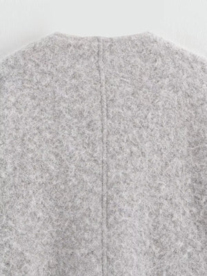 Textured knit tie-front coat in silver gray, showing back seam detail.
