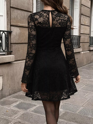 Black mini dress featuring lace and floral