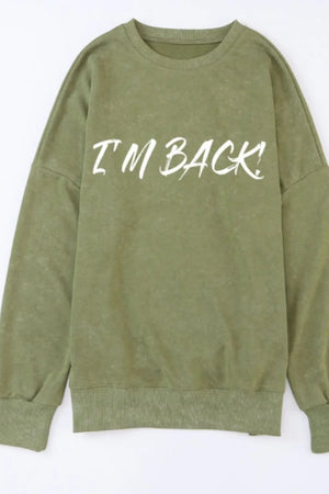 Moss green oversized slouch sweatshirt with white I'm Back! graphic print