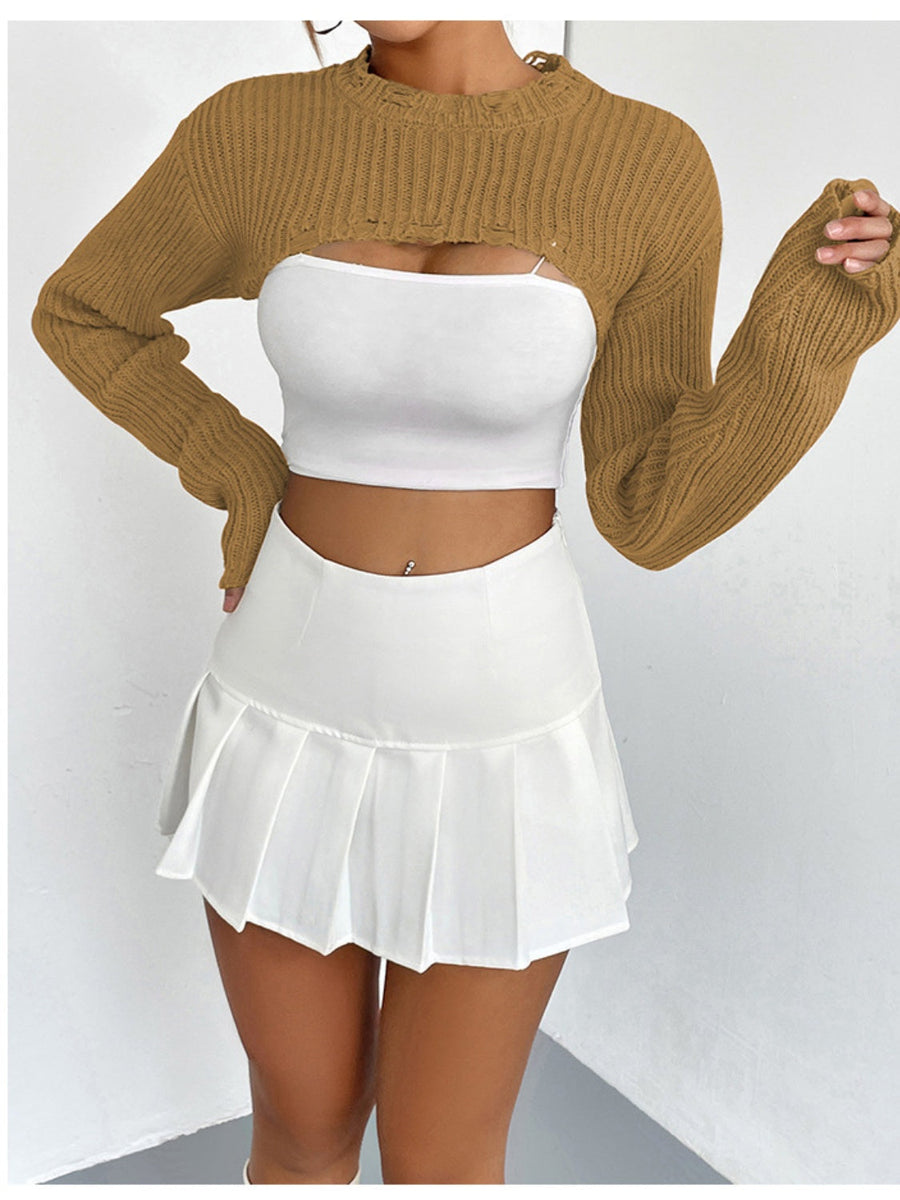 Tan distressed knit bolero crop top with ripped details and long sleeves.
