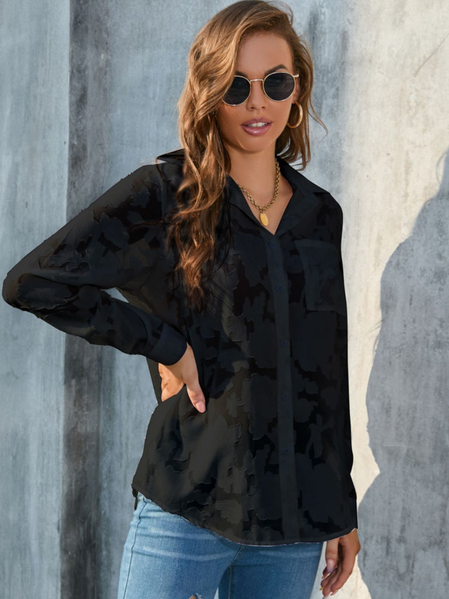 Black sheer button-down blouse with floral embroidery and two chest pockets.