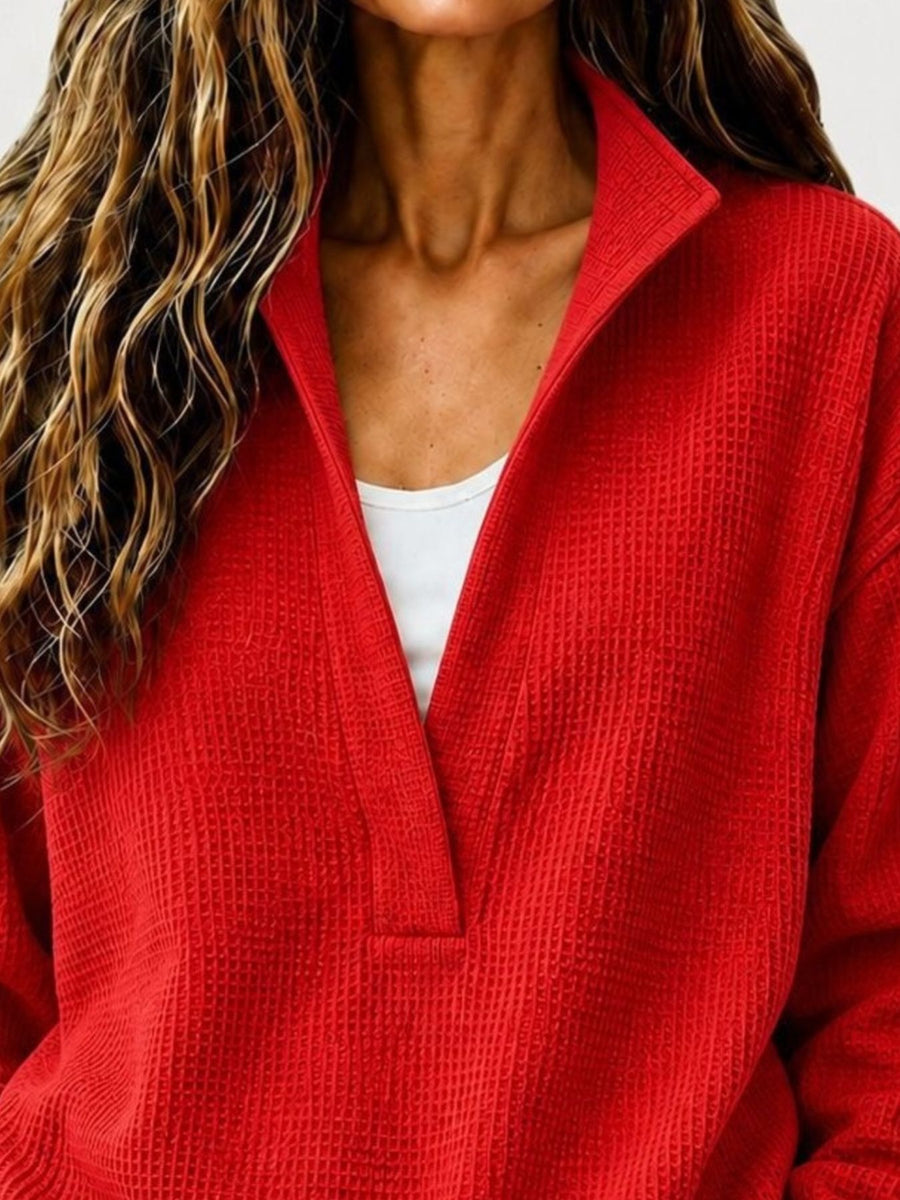 Black sweatshirt featuring waffle-knit and waffle-knit