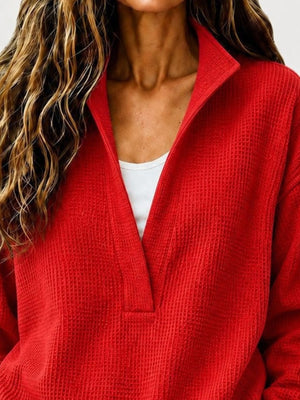 Black sweatshirt featuring waffle-knit and waffle-knit