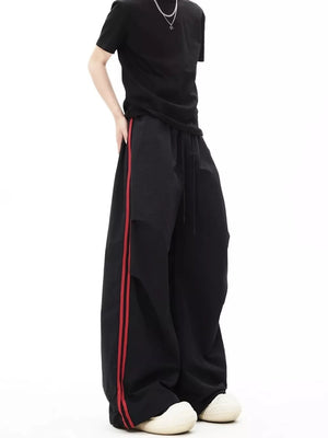 wide-leg pants in Black with striped and drawstring waist