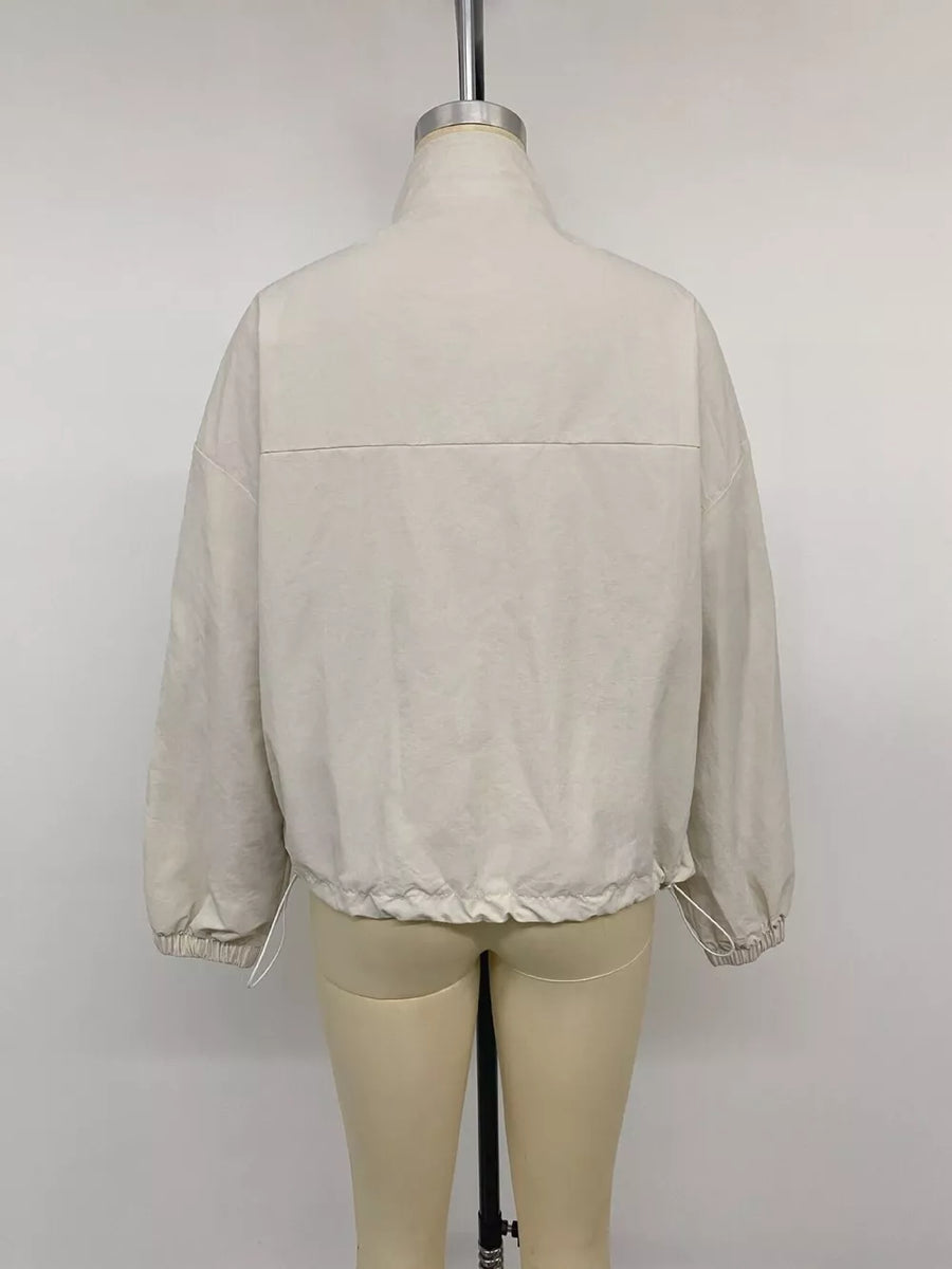 cream windbreaker