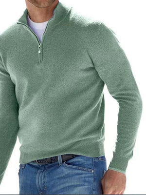 Green zip-up sweater with hip-length and quarter-zip