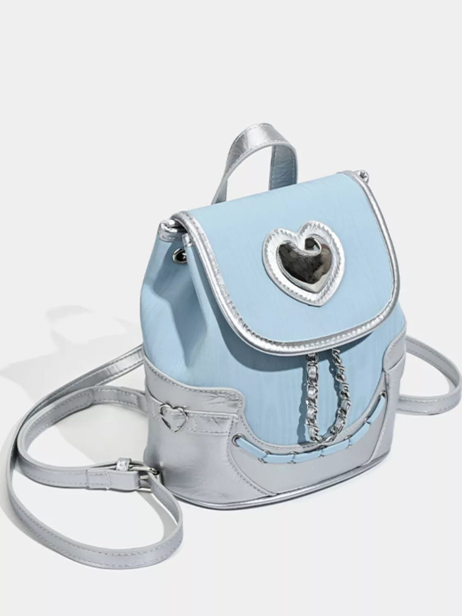 Blue mini backpack with silver trim, heart detail on flap and front pocket.