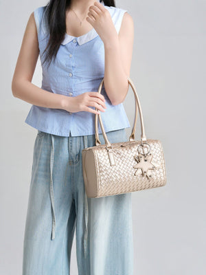 Champagne handbag featuring woven texture and woven texture