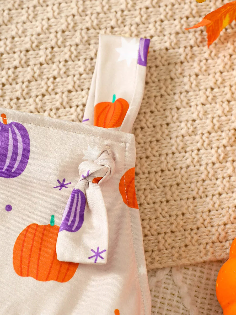 jumpsuit featuring pumpkin-print in white with 65% cotton, 35% polyester Care instructions: Machine wash cold texture