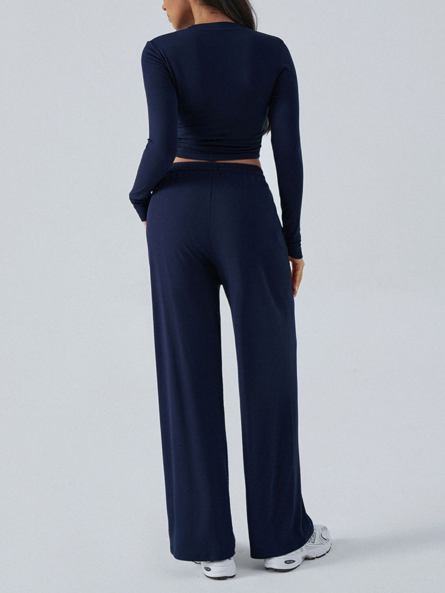Dark blue ribbed knit crop top and wide leg pants set from behind.