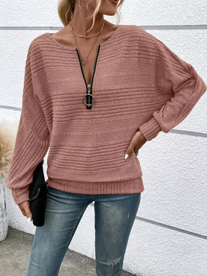 Pink ribbed acrylic sweatshirt with O-ring quarter zip and dolman sleeves.
