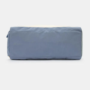 Colorblock gym duffel bag in dusty blue and beige with a mesh side detail.