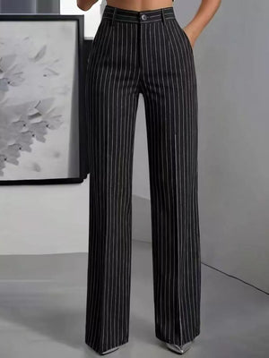 wide-leg pants in black featuring buttoned and flared fit