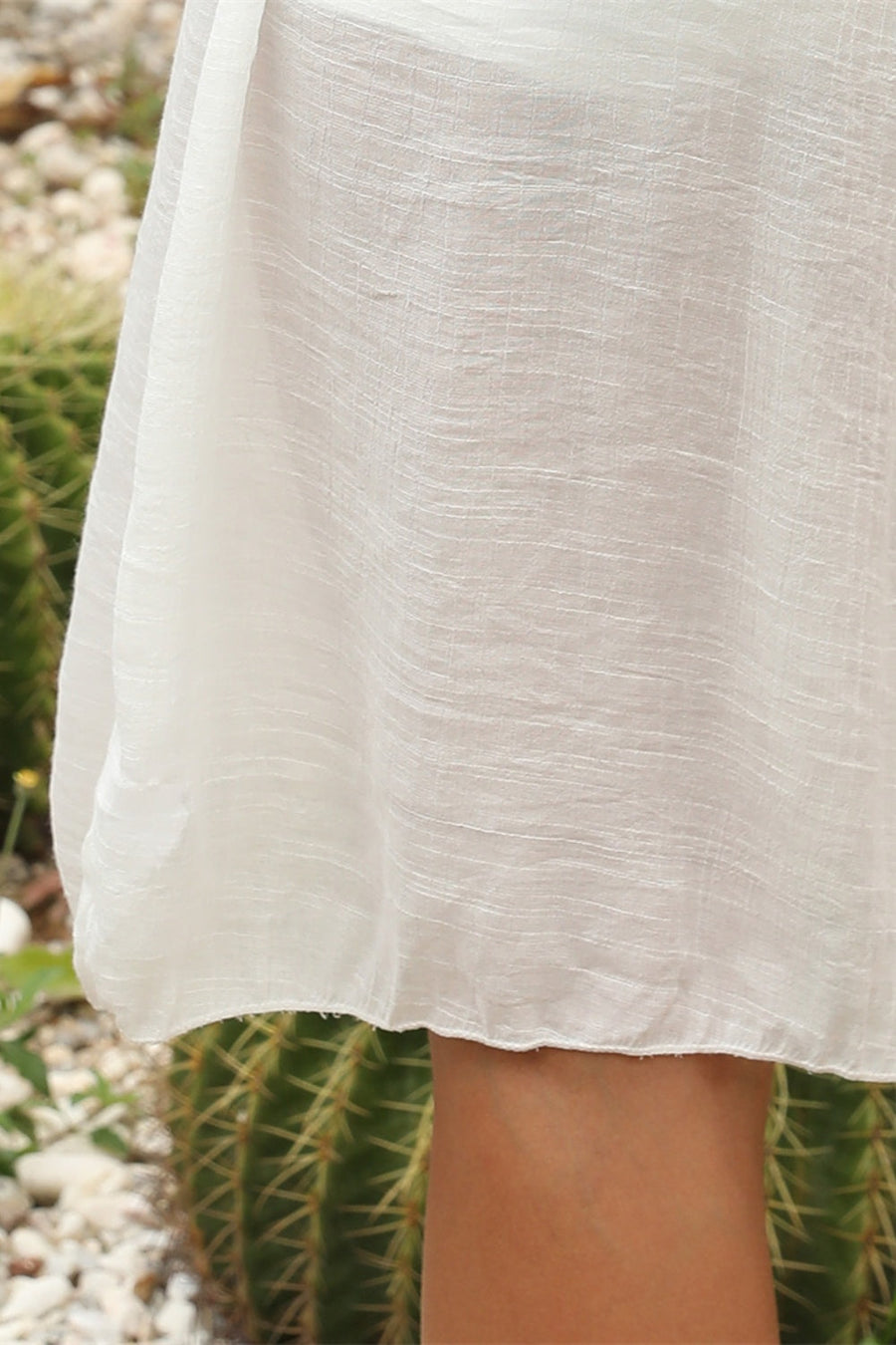 White crochet yoke cover-up dress with textured fabric and a scalloped hem.