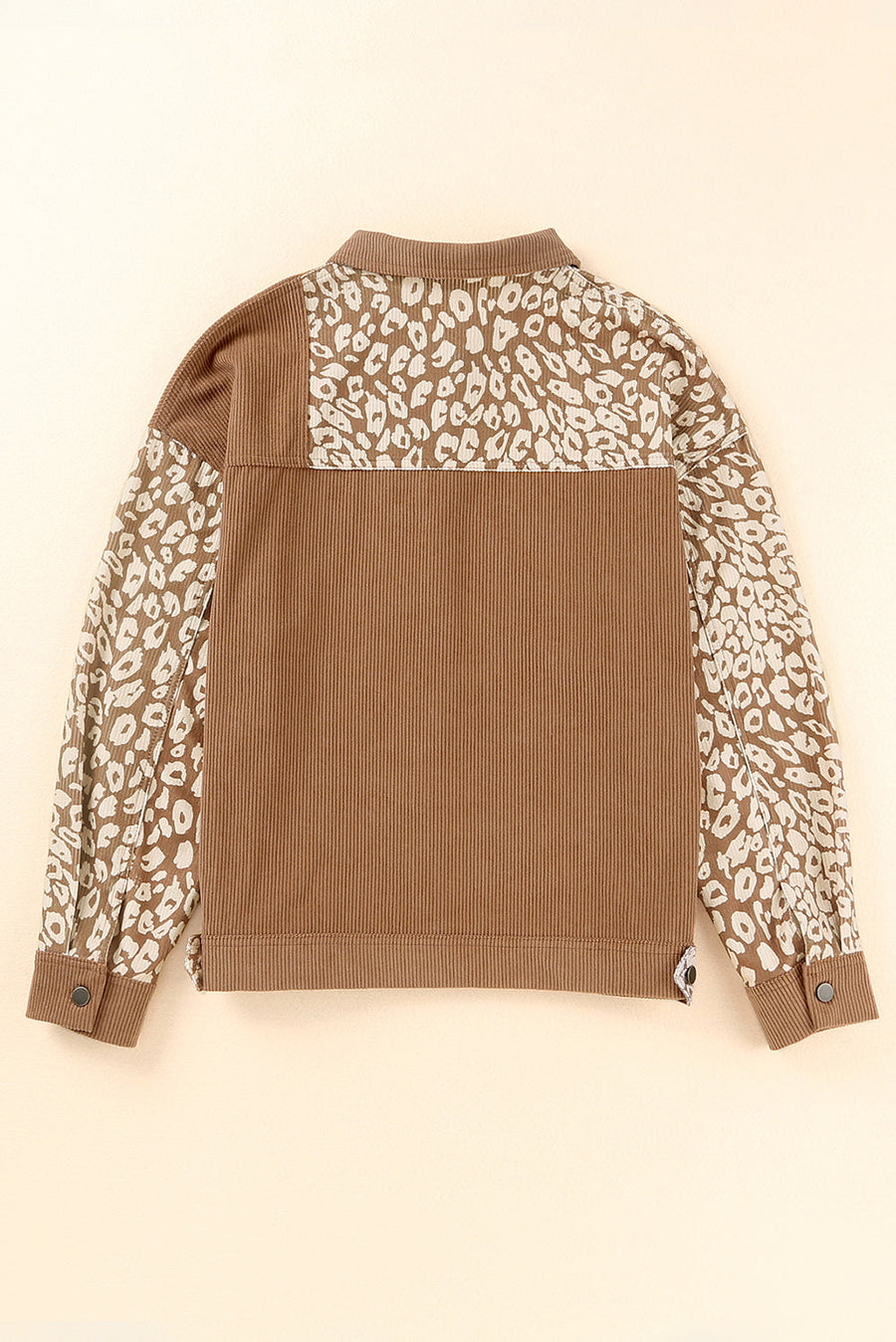 Camel corduroy jacket with leopard print panels on sleeves and yoke, buttoned cuffs.