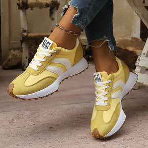 white sneakers with lace-up and striped