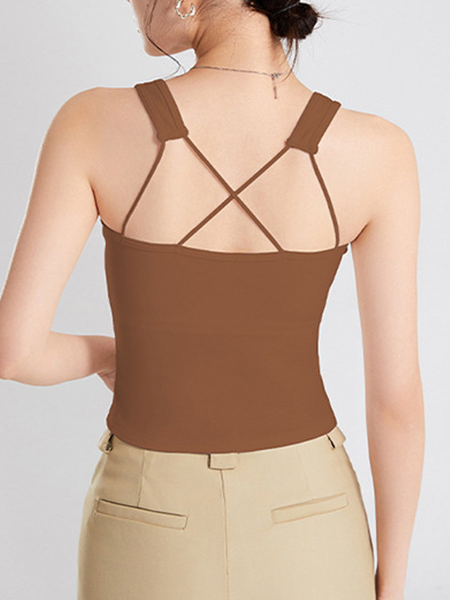 Caramel crop tank with crisscross spaghetti straps and wide shoulder straps.