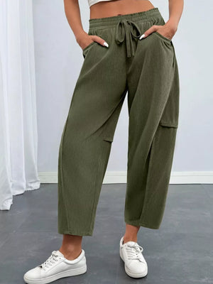 100% polyester Care instructions: Machine wash cold pants in Army Green with wide-leg silhouette