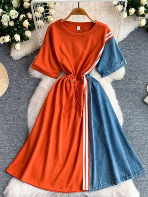 Color block casual dress with drawstring waist, orange top with white stripes, and denim skirt.