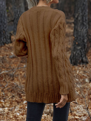 Chestnut cable knit cardigan with ribbed texture and cable sleeves.