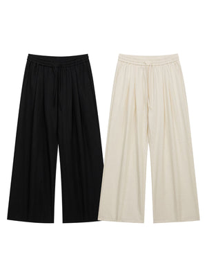 cream wide-leg pants with full-length and drawstring