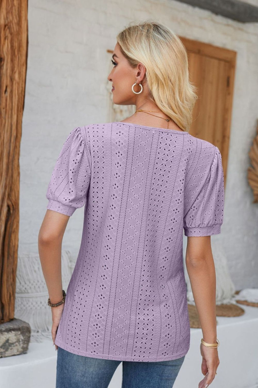Lavender perforated puff sleeve henley blouse with eyelet detail.