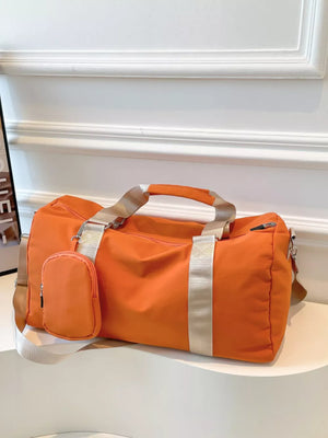 Orange duffle bag with detachable pouch and striped straps