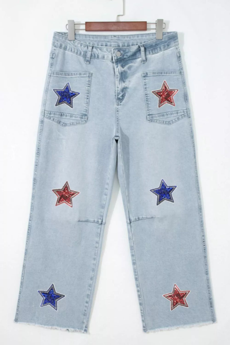 Light wash denim cropped utility jeans with red and blue sequin stars.