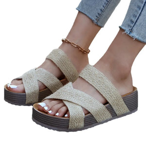 Zenith strappy platform sandals in beige with criss-cross straps and a thick sole.