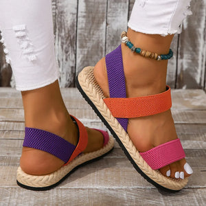 Rope-sole cross-strap sandals in orange, purple, and pink with elastic straps.