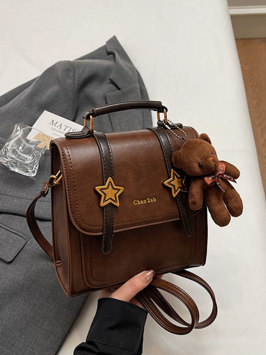 Star-Embellished Convertible Backpack Bag in brown with top handle