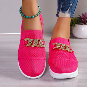 Rose red mesh slip-on flats with chunky chain detail and white soles.