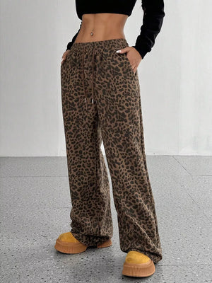 wide-leg pants in brown featuring drawstring waist and flared fit