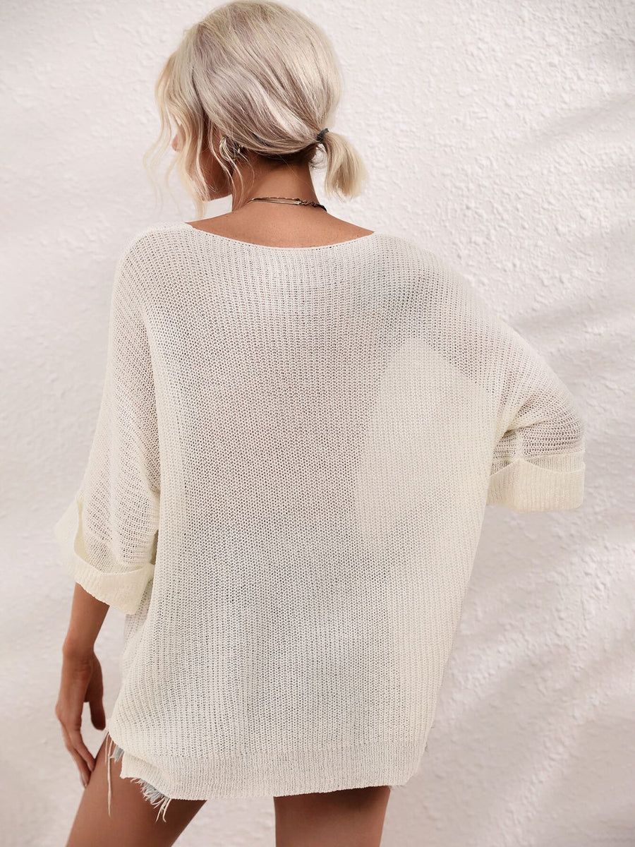 Ivory relaxed knit tunic top with boat neck and cuffed sleeves.