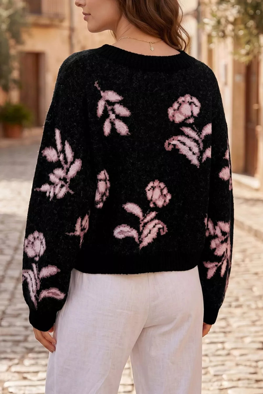 light pink pullover sweater featuring dropped shoulder and floral