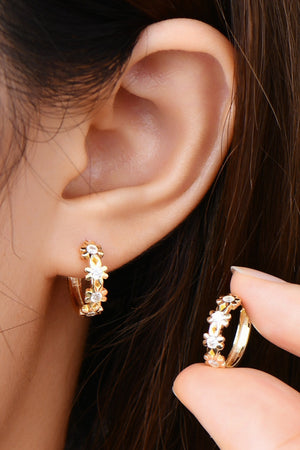 Gold huggie hoop earrings with floral crystal embellishments, 925 sterling silver.