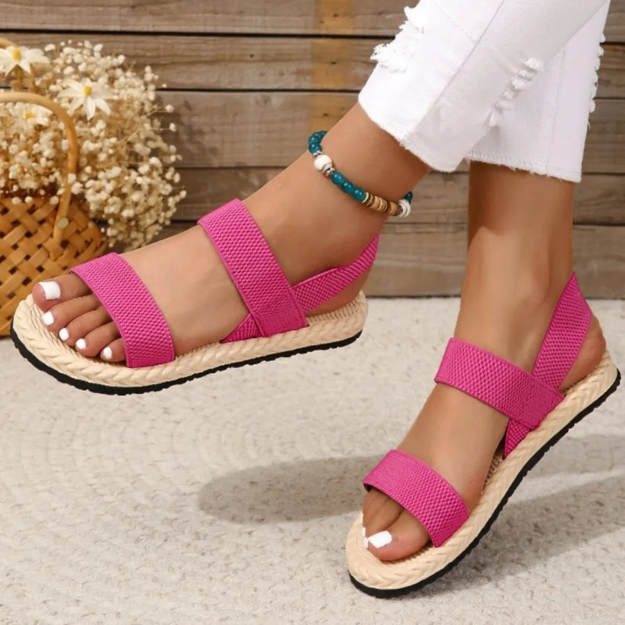 Hot Pink rope-sole cross-strap sandals with elastic straps and espadrille sole.