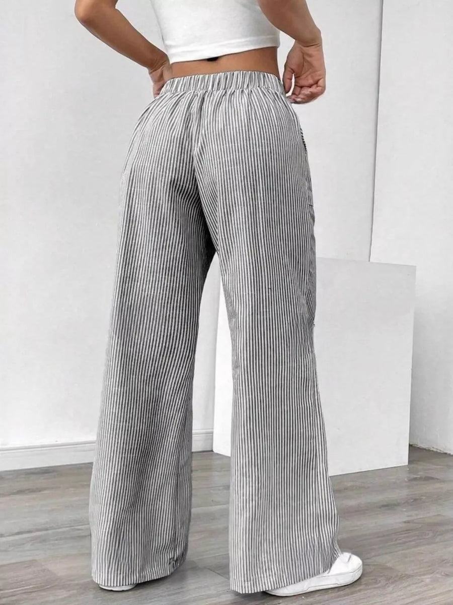 100% polyester Care instructions: Machine wash cold wide-leg pants in Light Gray with flared silhouette