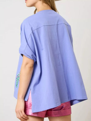 Blue polyester t-shirt with flip-flop embroidery detail on sleeve.