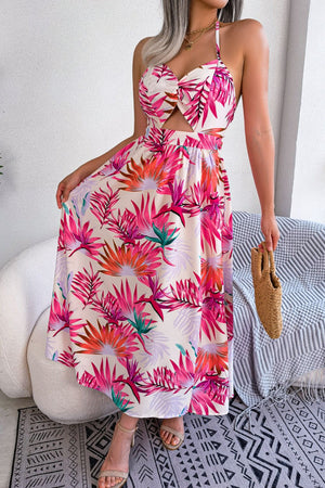 Tropical halter maxi dress with cutout and botanical print.