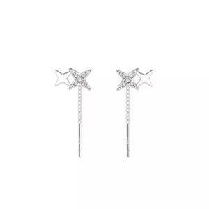 Silver earrings featuring star motif and star motif