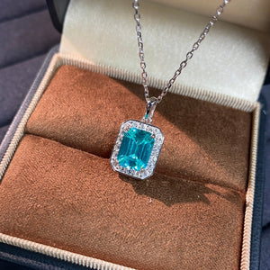 teal necklace featuring zircon accents and geometric