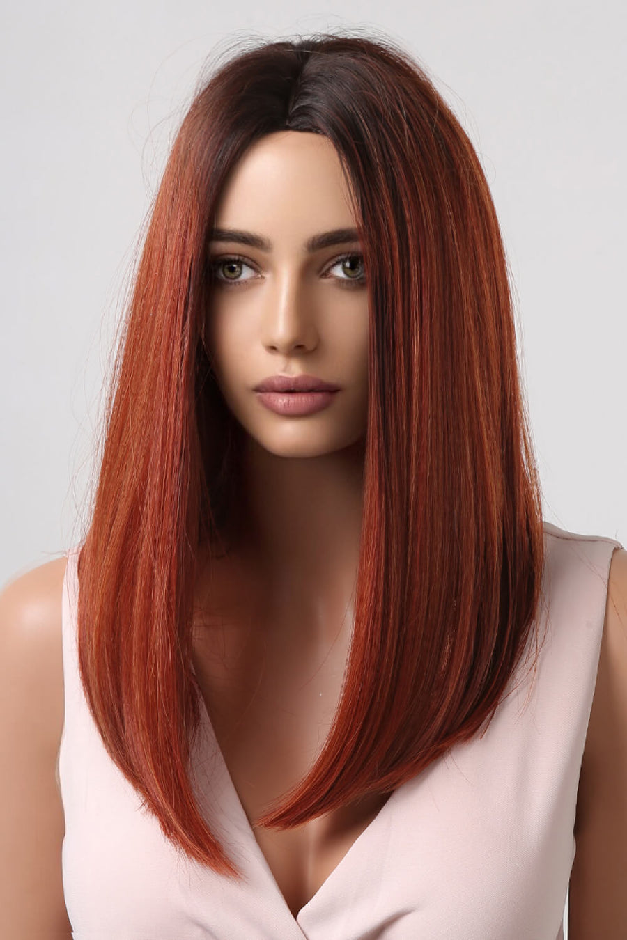 Auburn ombre wig with a center part and dark roots, styled straight.